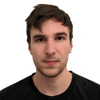 A young man with short brown hair and light skin, wearing a dark shirt, looks directly at the camera against a plain white background.