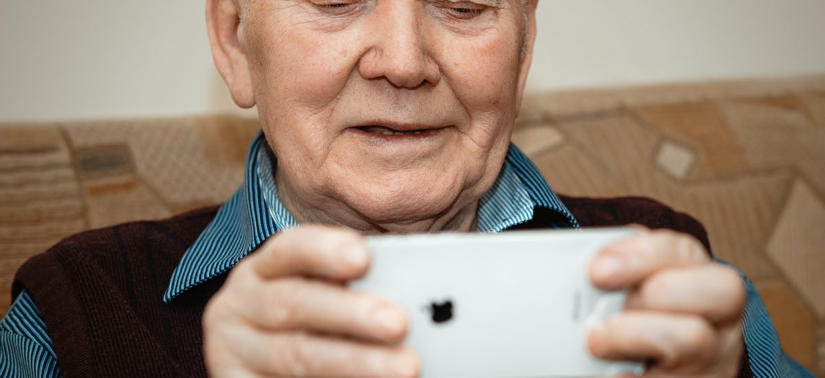 Picture of old man with mobile phone by Adam Niescioruk for Unsplash