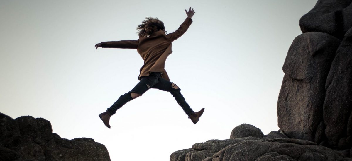 Picture of person jumping over cliffs