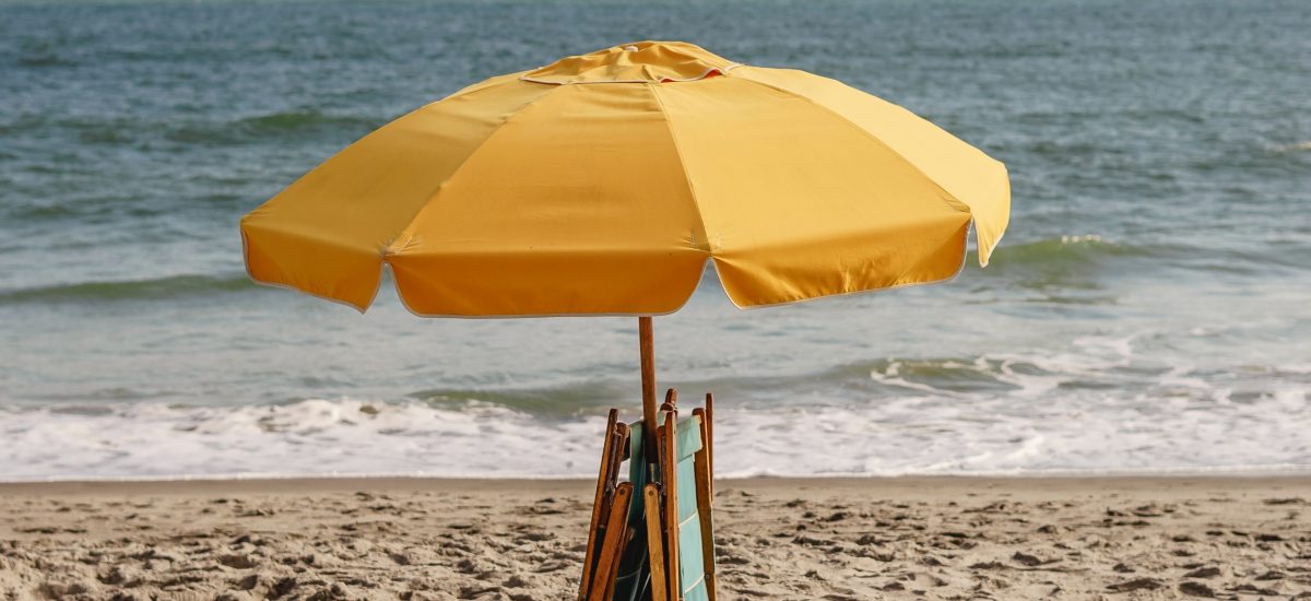 Yellow umbrella on the beach